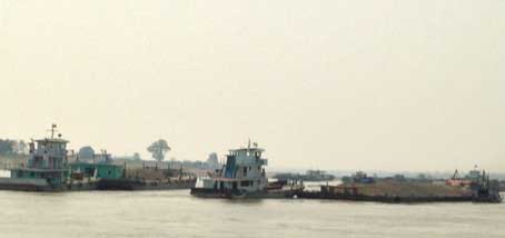 Big boat dragging pebble and sand Big boat dragging pebble and sand